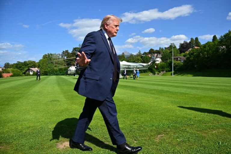 US President Donald Trump gestures after stepping off Marine One as he arrives to attend the G7 summit, in Evian, eastern France, on June 15.
