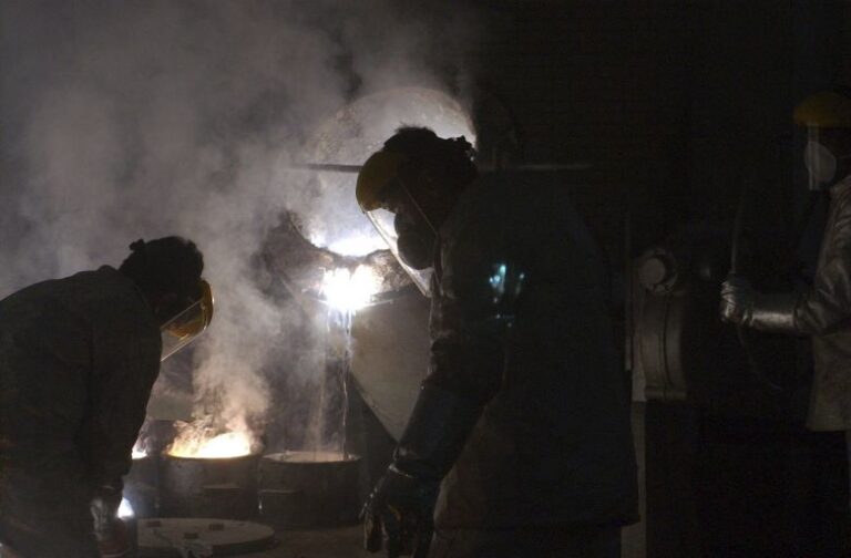 Iranian workers work zirconium production plant during President Mohammad Khatami's visit of the Uranium Conversion Facility, just outside the city of Isfahan, south of Tehran, Iran, on March 30, 2005.