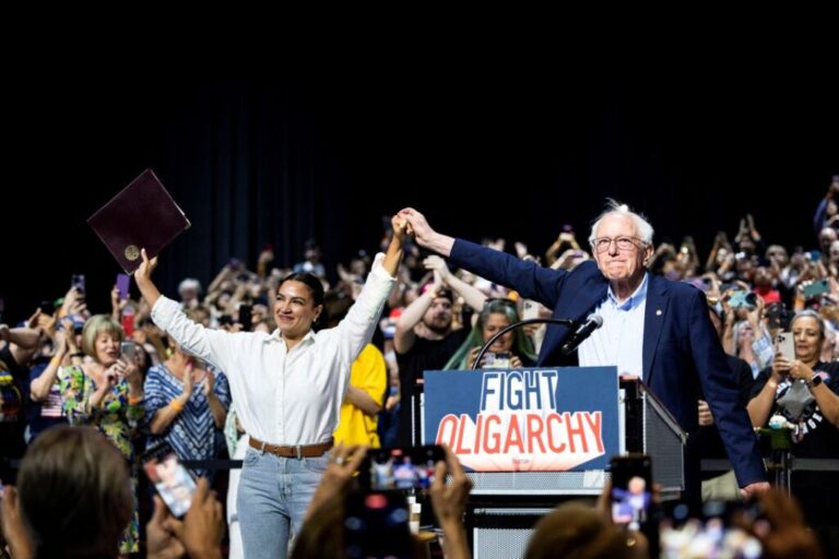 Rep. Alexandria Ocasio-Cortez and Sen. Bernie Sanders at a stop on the