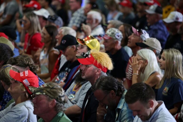 Supporters listen during a roundtable on agriculture with President Donald Trump at Custer Farms on Friday in Chippewa Falls, Wisconsin.