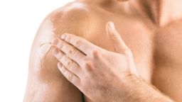 A man applies testosterone gel. Men in the study received a daily testosterone gel or a placebo for an average of 22 months.