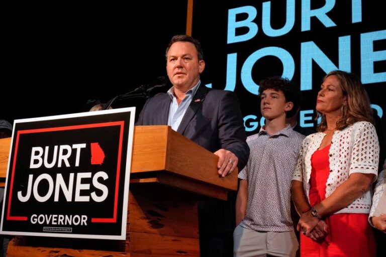 Republican gubernatorial candidate Burt Jones gives his concession speech as his wife Jan, right, looks on, after a runoff election during his election night watch party, on Tuesday, in Jackson, Georgia.