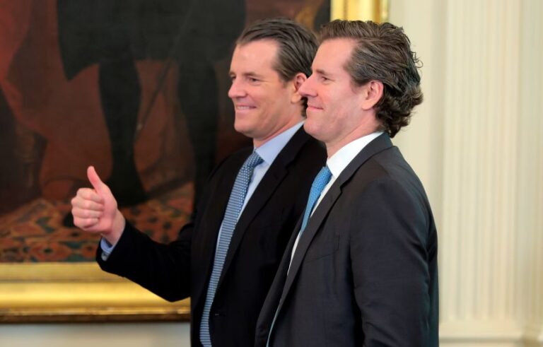 Tyler and Cameron Winklevoss attend the signing ceremony for the “GENIUS Act” in the East Room of the White House on July 18, 2025.