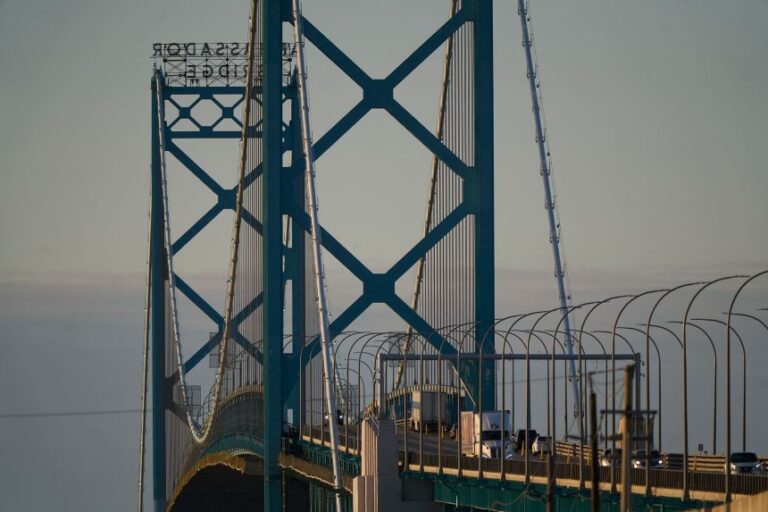 Trucks cross the US-Canada border along the Ambassador Bridge in Windsor, Ontario, on March 8, 2025.