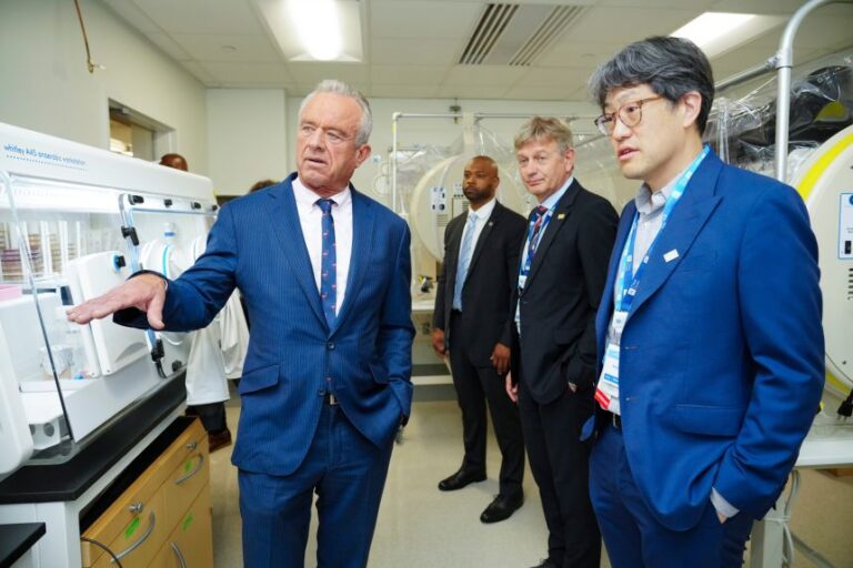 US Health and Human Services Secretary Robert F. Kennedy Jr., left, tours City of Hope's microbiome lab with Dr. Marcel van den Brink and Dr. Robert Jenq, right, on May 13 in Duarte, California.