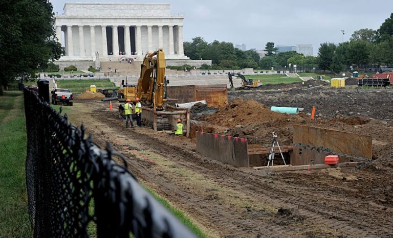 Construction crews working on the on the $30 million Lincoln Memorial Reflecting Pool replacement on August 15, 2011 in Washington, DC.