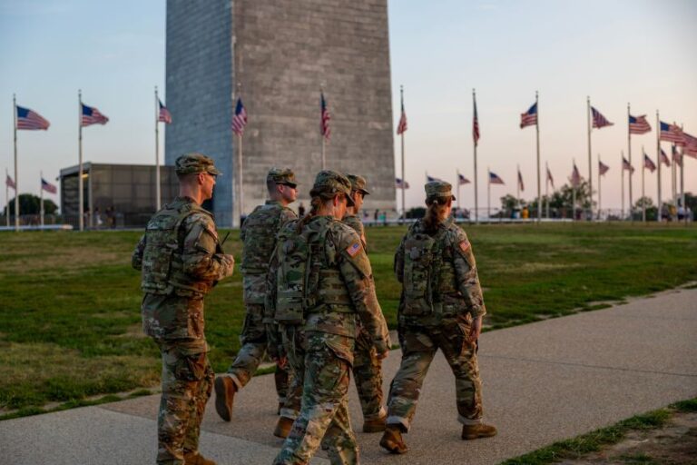Members of the National Guard patrol the Washington Monument on August 16, 2025 in Washington, DC.