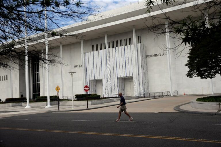 The wall of the John F. Kennedy Center for the Performing Arts is covered in tarp after President Donald Trump's name was removed, in Washington, DC, Sunday, June 14.