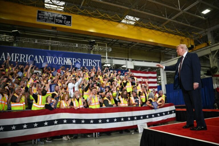 US President Donald Trump waves as he arrives to speak during a visit to the Mack Trucks manufacturing facility in Macungie, Pennsylvania, on Tuesday.