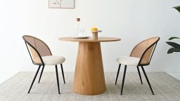 brown wooden pedestal dining table with two dining chairs