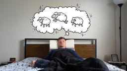 Person using the Snorinator Anti-Snoring Pillow.