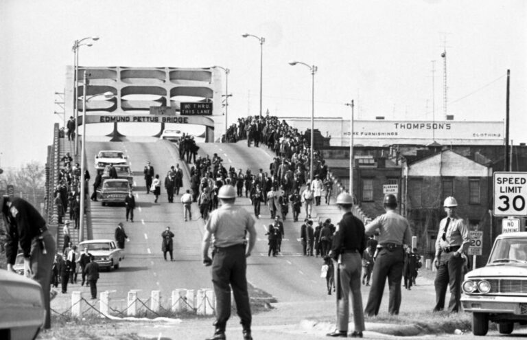 Civil rights marchers cross the Edmund Pettus Bridge on March 7, 1965, where they encountered a wall of state troopers and county posse waiting for them on the other side.
