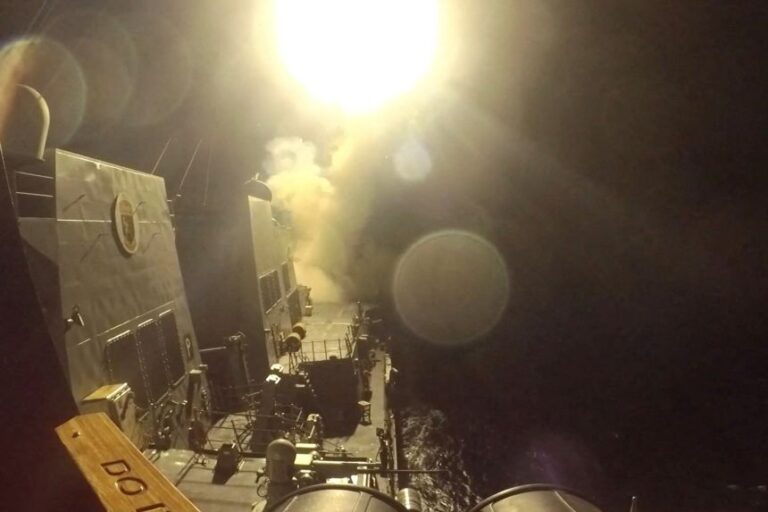 In this still image obtained from a handout video released on June 10, USS Michael Murphy launches Tomahawk cruise missiles from an unknown location.