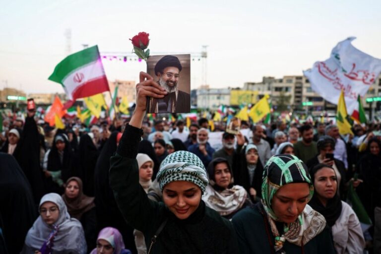A woman holds an image of Iran's supreme leader, Mojtaba Khamenei, during a rally in his support in Tehran on June 4, 2026.