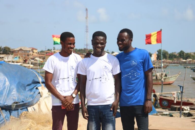 Issah Seidu (center) and AquaLife Conservancy collaborators Isaac Asefuah (left) and Kingsford Amankwah (right), with an image of a guitarfish printed on their shirts.