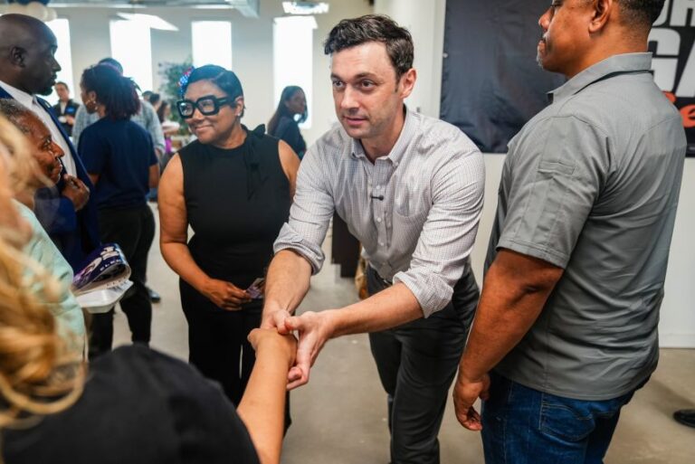 Sen. Jon Ossoff, center, greets a supporter during the opening of the Democratic Party of Georgia's South DeKalb Field Office and canvass kick off in Decatur, Georgia, US, on Saturday, May 23, 2026.