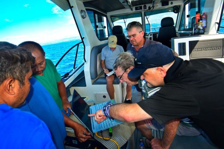 The team monitors a computer during a sonar scan on December 16, 2025.