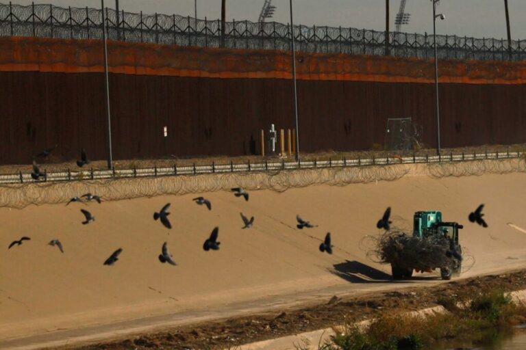 A member of the Texas National Guard operates machinery while replacing razor wire fence near the US-Mexico border wall, as tensions rise over the use of drones by suspected criminal groups, as seen from Ciudad Juarez, Mexico, February 12, 2026.