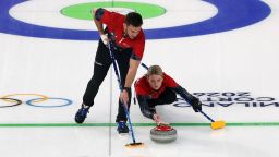 CORTINA D'AMPEZZO, ITALY - FEBRUARY 05: Korey Dropkin of Team United States and Cory Thiesse of Team United States compete during the Mixed Doubles Round Robin match between Team United States and Team Switzerland on day minus one of the Milano Cortina 2026 Winter Olympic games at Cortina Curling Olympic Stadium on February 05, 2026 in Cortina d'Ampezzo, Italy. (Photo by Al Bello/Getty Images)