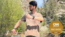 Person spraying himself with bug repellent
