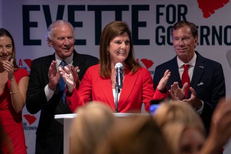 South Carolina Republican gubernatorial candidate Lt. Gov. Pamela Evette, with her husband David, right, and Gov. Henry McMaster, left, speaks to a crowd during an election night watch party on Tuesday in Greenville, South Carolina.