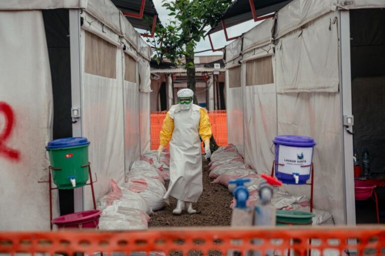 A doctor from Medecins Sans Frontieres (Doctors Without Borders) moves through the isolated red zone at the Ebola treatment center in Munigi, Democratic Republic of Congo, on June 2.