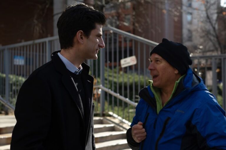 Jack Schlossberg speaks with a member of the New York State Nurses Association before joining the picket line in support of nurses on strike outside Mount Sinai West on January 12, 2026 in New York City.