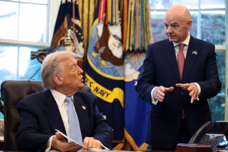 President Donald Trump sits next to FIFA President Gianni Infantino at the White House on November 17, 2025.