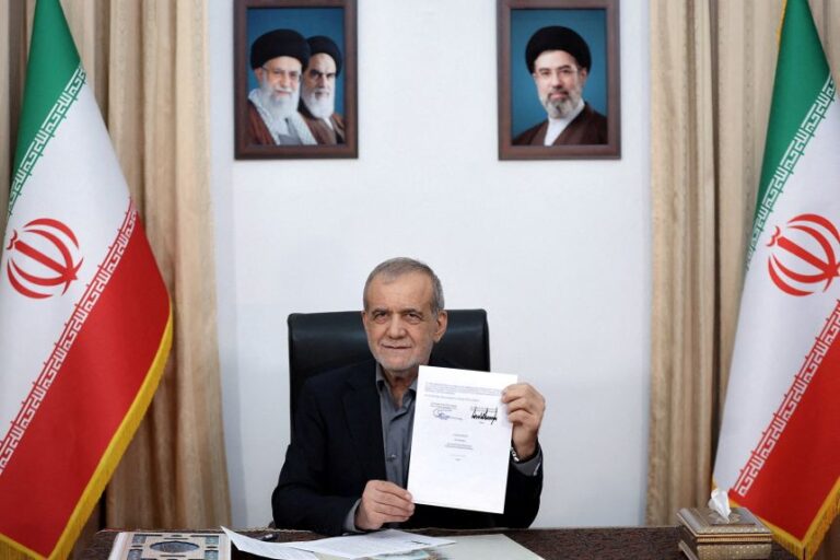 Iranian President Masoud Pezeshkian shows the signed memorandum of understanding in Tehran, Iran, on June 18.
