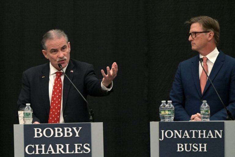 Maine Republican gubernatorial candidate Bobby Charles, left, fields a question from moderator Steve Robinson during a debate of Republican candidates for governor at Cross Insurance Center in Bangor, Maine, on Tuesday, March 24.