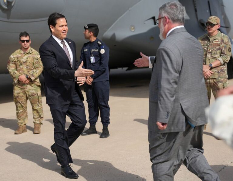 Secretary of State Marco Rubio is greeted by Steven Butler, charge d'affaires ad interim of the US Embassy in Kuwait, during his visit to the Middle East on June 24.