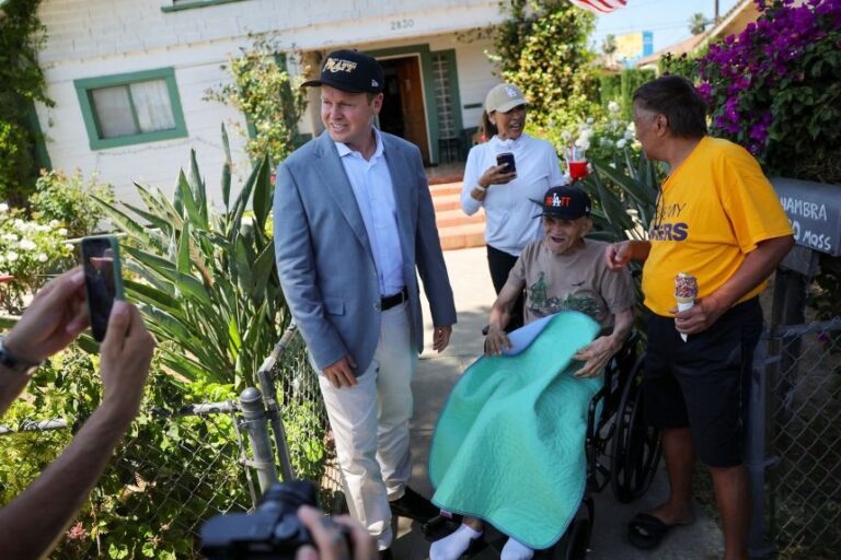 Spencer Pratt poses for pictures with supporters while campaigning for mayor of Los Angeles on May 31.