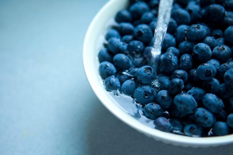 After a baking soda soak, rinse blueberries with cool water and dry carefully to prevent spoilage.