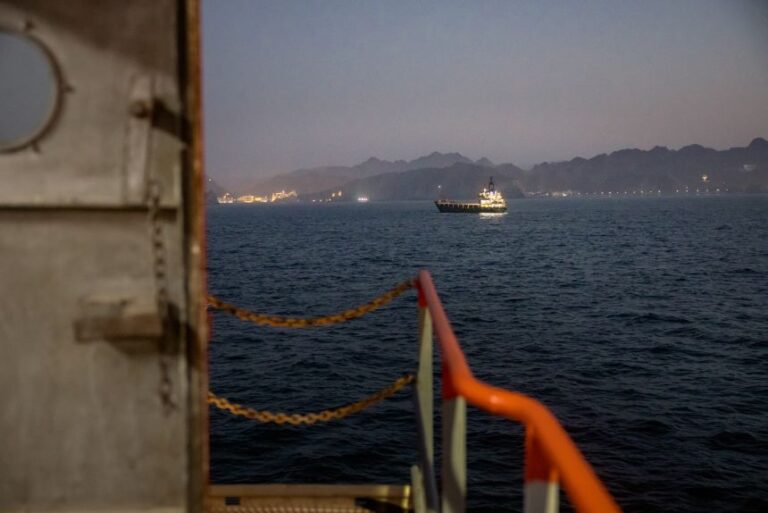 A cargo vessel is seen from another cargo vessel anchored off the coast of Oman on June 23.