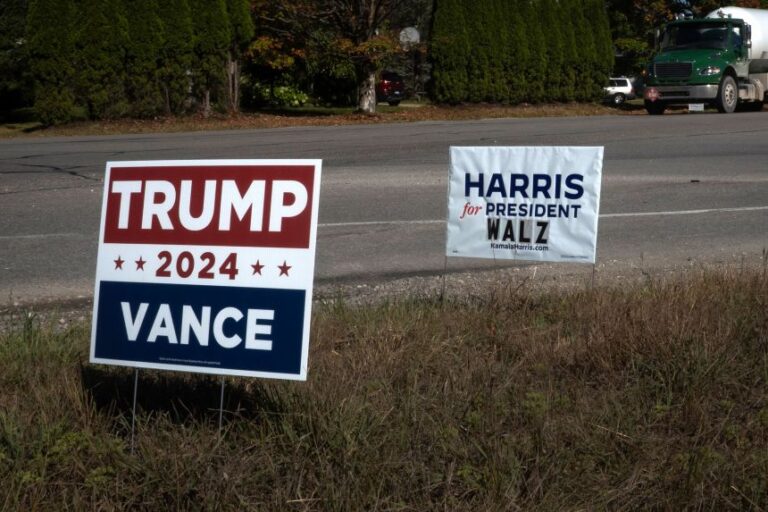 Signs showing support for Democratic presidential candidate Vice President Kamala Harris and Republican presidential candidate President Donald Trump on September 26, 2024, near Traverse City, Michigan.