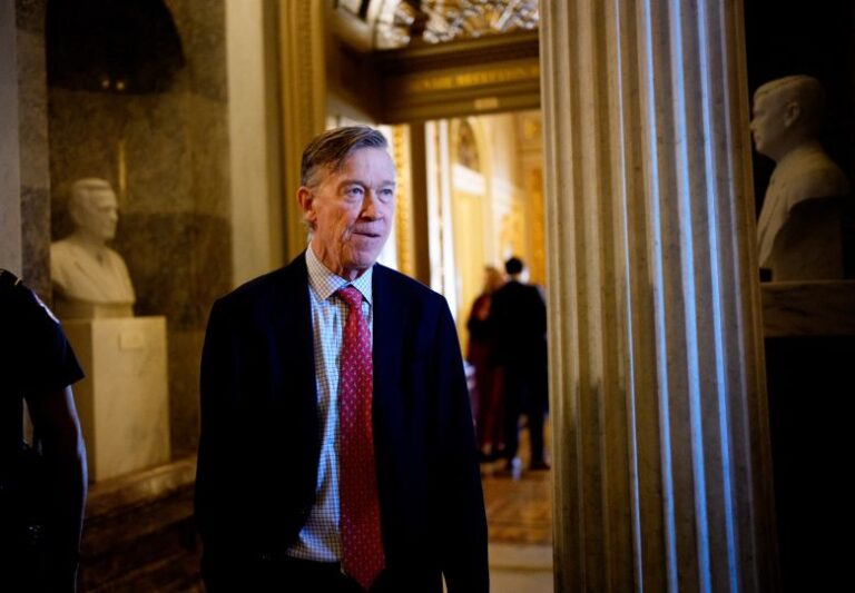 Sen. John Hickenlooper (D-CO) walks out of the Senate Chamber on December 11, 2025 in Washington, DC.