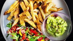French fries served with a salad and avocado