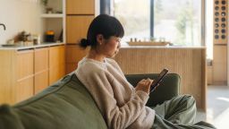 Photo of a Japanese woman using a phone.