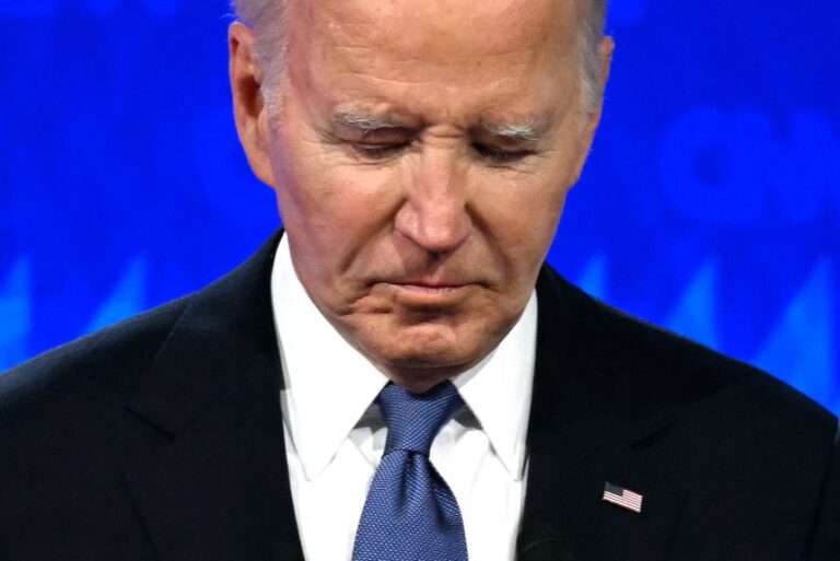 Former US President Joe Biden looks down as he participates in the first presidential debate of the 2024 elections with Donald Trump at CNN's studios in Atlanta, Georgia, on June 27, 2024.
