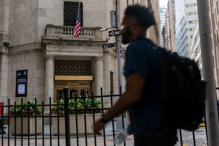 People walk outside of the New York Stock Exchange (NYSE) in Manhattan on Wednesday in New York City.