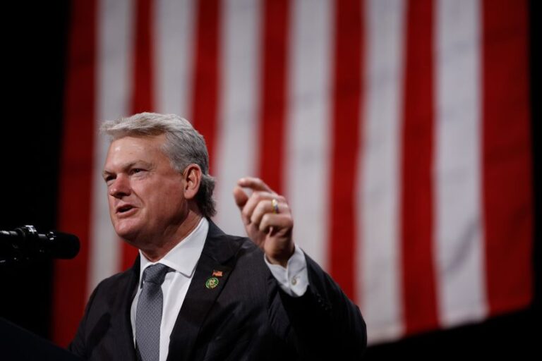 Rep. Mike Collins speaks before then-nominee Donald Trump during a campaign rally in Atlanta, Georgia, on October 15, 2024.
