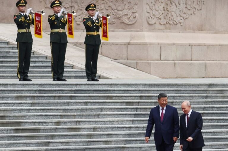 Russian President Vladimir Putin and Chinese President Xi Jinping attend a welcoming ceremony at the Great Hall of the People in Beijing, on May 20.