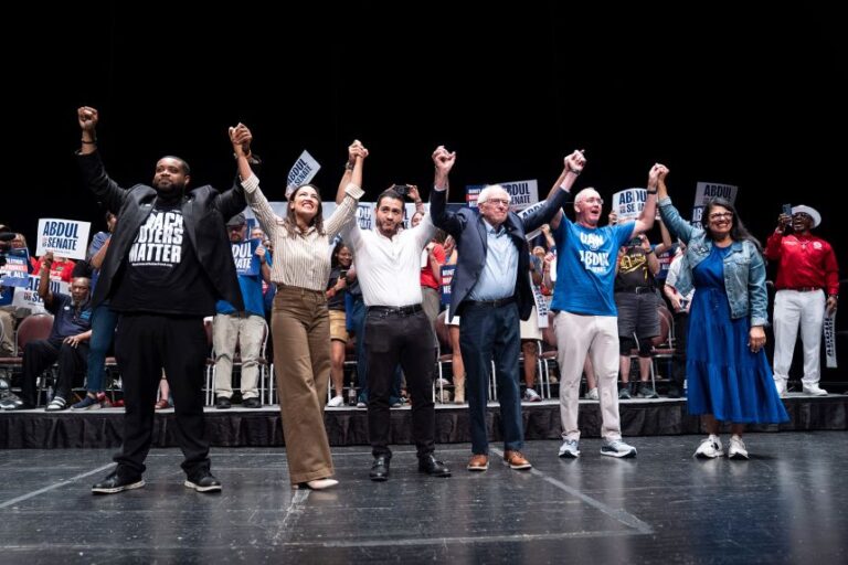 Democratic candidate for US Senate Abdul El-Sayed, center, greets a campaign rally crowd alongside Michigan state Rep. Donavan McKinney, Rep. Alexandria Ocasio-Cortez, Sen. Bernie Sanders, UAW President Shawn Fain and Rep. Rashida Tlaib greet the crowd after El-Sayed spoke, at the Detroit Opera House in Detroit, Michigan, on July 18.