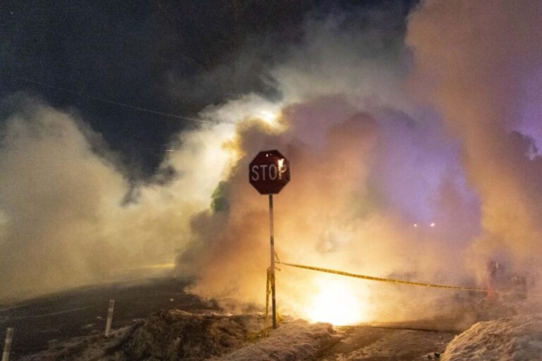 Federal agents deploy tear gas and pepper balls against community members, during a protest following a shooting involving federal law enforcement in north Minneapolis, on January 14.