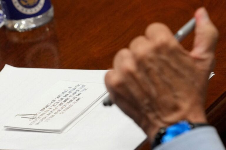 A note lies on a table in front of Anthony Fauci, as he attends a Senate Homeland Security and Governmental Affairs Committee hearing on July 29.