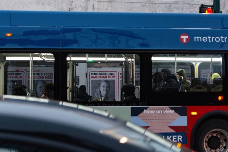 A line of posters honoring Renee Good are seen pasted on the side of a building in Minneapolis, on January 15.