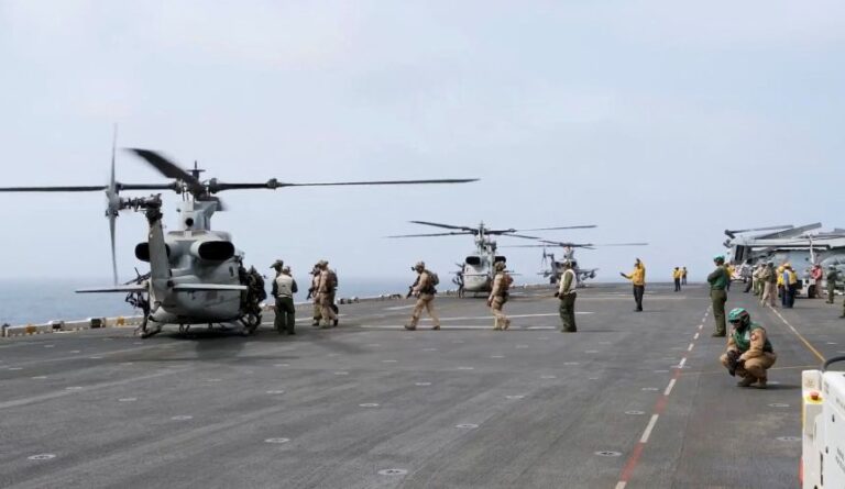 Military helicopters and personnel operate in a location given as the Arabian Sea in this screengrab obtained from a video released by US Central Command (CENTCOM) on July 25.