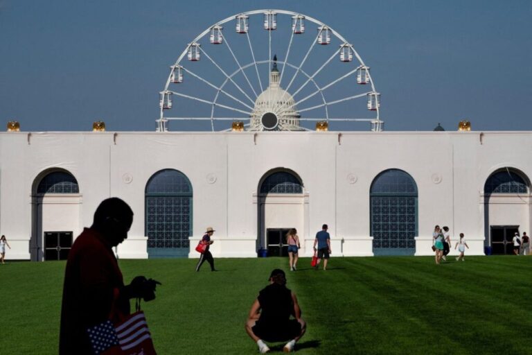 Visitors walk the grounds at the Great American State Fair on the National Mall, June 25.