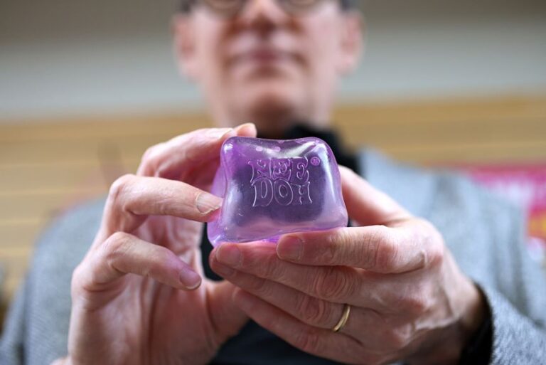 Paul Weingard, president and CEO of toymaker Schylling, holds a NeeDoh toy. The company warns that they should not be