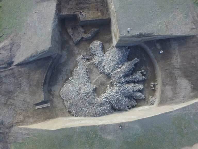 An overhead view shows a burial mound after excavation work had begun. It was dated between the eighth and seventh centuries BC.